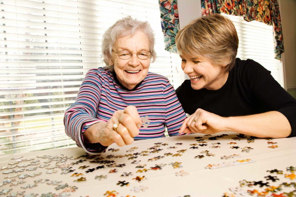 Mom and Daughter Playing Puzzle
